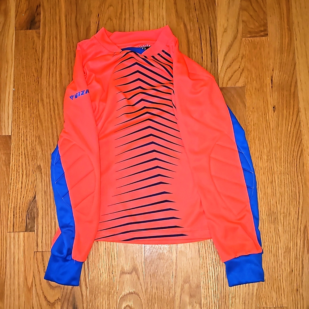 Goalie jersey with forearm pads. Neon orange and blue